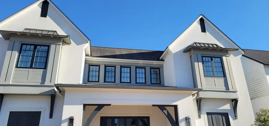 Bright, clean Louisiana home exterior with crisp rooflines and siding